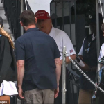 The outing came amid wild rumors surrounding the Repulican's health. Trump sported his go-to golf outfit - black pants, a white polo shirt and his signature red MAGA hat